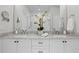 Bathroom featuring a double vanity with marble countertops and modern fixtures at 3408 Landen Pine Ne Ct, Atlanta, GA 30305
