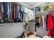 Spacious walk-in closet with ample hanging space and shelving for organization, perfect for wardrobe storage and arrangement at 3408 Landen Pine Ne Ct, Atlanta, GA 30305