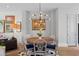 Elegant dining room with round table, unique chandelier, and hardwood floors at 3408 Landen Pine Ne Ct, Atlanta, GA 30305