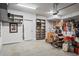 Organized two-car garage with ample storage space, shelving units, and epoxy flooring, ideal for car and tool storage at 3408 Landen Pine Ne Ct, Atlanta, GA 30305