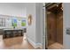 Modern kitchen view featuring a center island with seating and hardwood floors next to an elevator at 3408 Landen Pine Ne Ct, Atlanta, GA 30305
