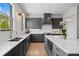 Modern kitchen with grey cabinetry, white backsplash, and stainless steel appliances at 3408 Landen Pine Ne Ct, Atlanta, GA 30305