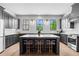Modern kitchen with grey cabinetry, a large center island, and stainless steel appliances at 3408 Landen Pine Ne Ct, Atlanta, GA 30305