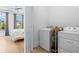 Laundry area with appliances next to bedroom at 3408 Landen Pine Ne Ct, Atlanta, GA 30305