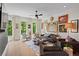 Bright living room with hardwood floors, multiple windows, and stylish decor at 3408 Landen Pine Ne Ct, Atlanta, GA 30305