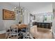 Open concept living room and kitchen with a hardwood floor, neutral colors, and an island at 3408 Landen Pine Ne Ct, Atlanta, GA 30305