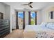 A nicely appointed bedroom with wood floors, ceiling fan, and decor at 3408 Landen Pine Ne Ct, Atlanta, GA 30305