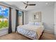 Spacious bedroom with hardwood floors, ceiling fan, and natural light at 3408 Landen Pine Ne Ct, Atlanta, GA 30305