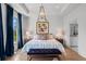 Relaxing main bedroom with tray ceiling, blue accents, and ensuite bathroom at 3408 Landen Pine Ne Ct, Atlanta, GA 30305