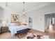 Spacious main bedroom with a tray ceiling, ensuite bathroom, and hardwood floors at 3408 Landen Pine Ne Ct, Atlanta, GA 30305