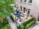 Charming outdoor patio area with lush landscaping, cozy seating, and privacy walls, creating a perfect space for relaxation at 3408 Landen Pine Ne Ct, Atlanta, GA 30305