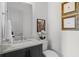 A quaint powder room with decorative artwork, a sink and a toilet at 3408 Landen Pine Ne Ct, Atlanta, GA 30305