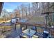Enjoy the outdoors on this wooden deck with a table, chairs, and a lovely view of the landscaped backyard at 52 Buena Vista Se Cir, Cartersville, GA 30121