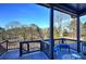 Back porch with seating, creating a relaxing outdoor retreat with a view of the surrounding trees at 52 Buena Vista Se Cir, Cartersville, GA 30121