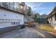 The spacious backyard features a shed, deck, patio area, retaining wall and a walkway to the upper level at 52 Buena Vista Se Cir, Cartersville, GA 30121