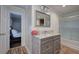 Bathroom featuring a vanity with marble countertop, wood-look plank flooring, and shower with glass doors at 52 Buena Vista Se Cir, Cartersville, GA 30121