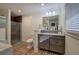 Modern bathroom with a glass-enclosed shower, vanity with marble countertop, and plank flooring at 52 Buena Vista Se Cir, Cartersville, GA 30121