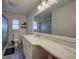 Bathroom featuring a marble vanity top, large mirror, and a glass shower at 52 Buena Vista Se Cir, Cartersville, GA 30121