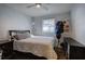 Bedroom with wood floors, a bed, and a window that lets in natural light at 52 Buena Vista Se Cir, Cartersville, GA 30121