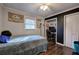 Cozy bedroom featuring hardwood floors, ceiling fan, and natural light from window at 52 Buena Vista Se Cir, Cartersville, GA 30121