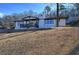 Charming single-story home boasts painted brick, a covered porch, and a landscaped front yard at 52 Buena Vista Se Cir, Cartersville, GA 30121