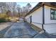 Exterior of the home featuring a convenient driveway, fencing, and outdoor access at 52 Buena Vista Se Cir, Cartersville, GA 30121