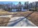 Charming single-story home with long driveway and mature trees in the front yard at 52 Buena Vista Se Cir, Cartersville, GA 30121