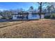 Charming single-story home with a welcoming front porch and well-maintained landscaping at 52 Buena Vista Se Cir, Cartersville, GA 30121