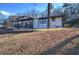 Charming single-story home boasts painted brick, a covered porch, and a landscaped front yard at 52 Buena Vista Se Cir, Cartersville, GA 30121