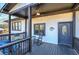 Relaxing front porch with rocking chairs, a ceiling fan, and white painted brick at 52 Buena Vista Se Cir, Cartersville, GA 30121