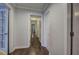 Hallway with dark hardwood flooring that provides access to multiple rooms at 52 Buena Vista Se Cir, Cartersville, GA 30121