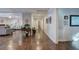 Inviting hallway with dark hardwood floors leading to the living room, complete with tasteful decor and ample lighting at 52 Buena Vista Se Cir, Cartersville, GA 30121