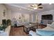 Cozy living room with a fireplace, shiplap accent wall, and hardwood floors at 52 Buena Vista Se Cir, Cartersville, GA 30121