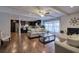 Open-concept living room flows to a dark wood kitchen and features a fireplace at 52 Buena Vista Se Cir, Cartersville, GA 30121