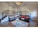 Open-concept living room with a staircase, features a barn door to the side at 52 Buena Vista Se Cir, Cartersville, GA 30121