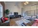 Cozy living room boasts hardwood floors, ample seating, and a stylish entertainment center with decorations and large tv at 52 Buena Vista Se Cir, Cartersville, GA 30121