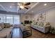 Open-concept living room features a fireplace and large window with backyard view at 52 Buena Vista Se Cir, Cartersville, GA 30121
