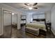 Spacious main bedroom featuring dark hardwood floors, a ceiling fan, and a mirrored closet at 52 Buena Vista Se Cir, Cartersville, GA 30121