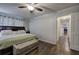 Spacious main bedroom featuring hardwood floors, a ceiling fan, natural light, and a decorative bench at 52 Buena Vista Se Cir, Cartersville, GA 30121
