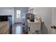 Functional utility room with a water heater, sink, mini fridge, and access to the backyard at 52 Buena Vista Se Cir, Cartersville, GA 30121