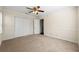 Spacious bedroom featuring carpet, a ceiling fan, and a large closet at 610 Mill Pond Se Dr, Smyrna, GA 30082
