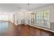 Inviting dining area with hardwood floors, bright lighting, and lots of windows at 610 Mill Pond Se Dr, Smyrna, GA 30082