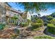 Inviting two-story condo with lush landscaping and walkway leading to the entrance, perfect for peaceful living at 610 Mill Pond Se Dr, Smyrna, GA 30082