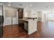 Efficient kitchen layout featuring granite countertops, stainless steel appliances and a laundry closet at 610 Mill Pond Se Dr, Smyrna, GA 30082