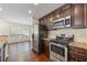 Bright and open kitchen featuring stainless steel appliances and a breakfast nook, perfect for casual dining at 610 Mill Pond Se Dr, Smyrna, GA 30082
