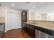 Well-equipped kitchen featuring stone countertops, stainless steel appliances, and ample storage space at 610 Mill Pond Se Dr, Smyrna, GA 30082