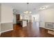 Spacious living area featuring hardwood floors and seamless transitions into the kitchen at 610 Mill Pond Se Dr, Smyrna, GA 30082