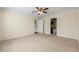 Large main bedroom with carpet, a ceiling fan, and access to the en-suite bathroom at 610 Mill Pond Se Dr, Smyrna, GA 30082