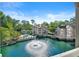 Beautiful water view showcasing the luxurious community homes and a striking water fountain at 610 Mill Pond Se Dr, Smyrna, GA 30082