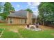The home features a backyard with a stone patio, built in fire pit and a covered wooden pergola at 865 Ashfield Dr, Decatur, GA 30030